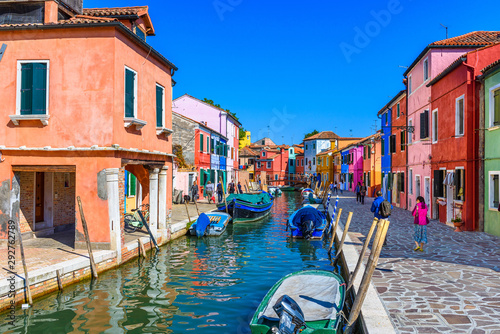 Street with colorful buildings and canal in Burano island, Venice, Italy. Arc...