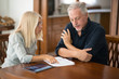 © Minerva Studio - Senior couple calculating their living expenses together