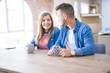 © Krakenimages.com - Young couple taking a break drinking a cup of coffee, very happy for moving to a new home