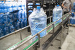 canvas print picture - Conveyor line or belt with clean pure drinking water in plastic bottles packed in cellophane, loading finished goods at water factory