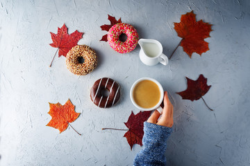 Wall Mural - Colorful donuts with a Cup of coffee