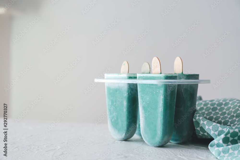 Tasty homemade spirulina ice-cream on table