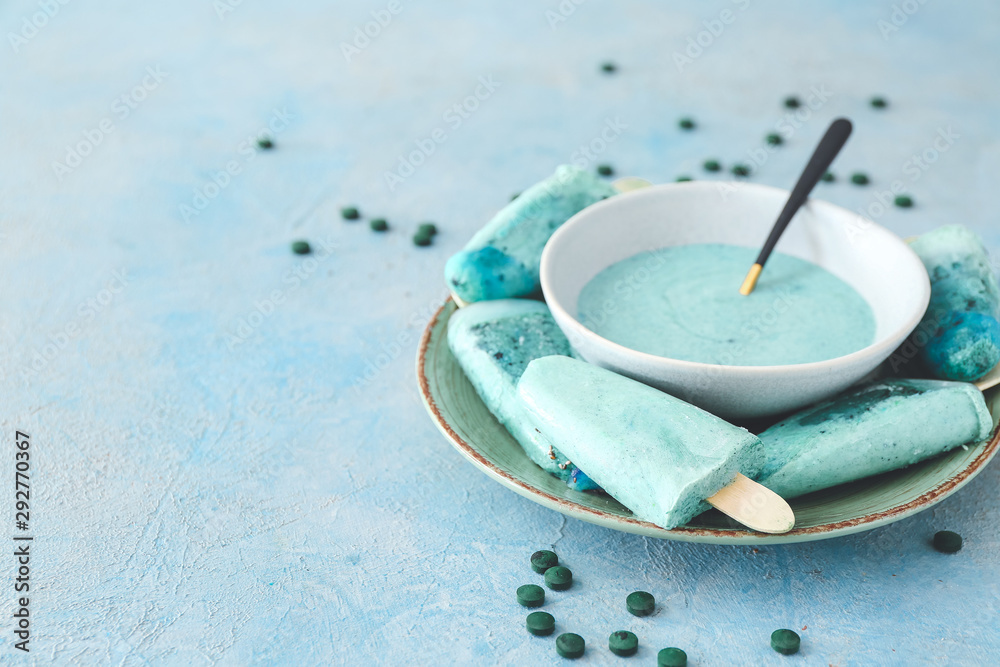 Plate with tasty spirulina ice-cream on table