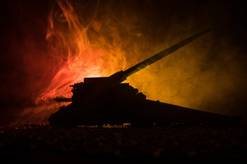 German canon on the train. World wars weapon resized artwork on table with dark toned foggy background. Battle scene.