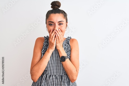 Fotografía Beautiful woman with bun wearing casual dresss standing over isolated white back