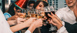 © Mongkolchon - group of diversity business people having fun and having wine glass toasting together in corporate new year and Christmas party with music and dancing at workplace
