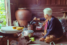 Portrait Of Senior Asian Woman Chef Cook In The Kitchen, Countryside In Thailand