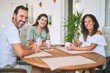 © Krakenimages.com - Beautiful family sitting on terrace drinking cup of coffee speaking and smiling
