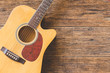 Top view of  Acoustic guitar on wood background and copy space