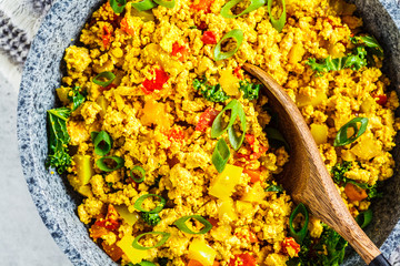 Wall Mural - Tofu scramble with vegetables in a pan. Vegan Alternative Omelet.