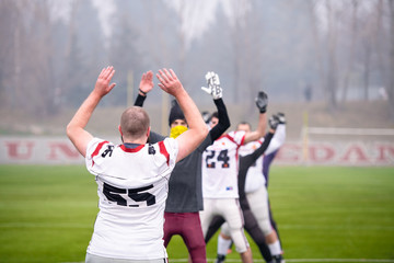 Wall Mural - american football players stretching and warming up