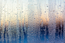 A Foggy Window At Sunset As An Abstract Background