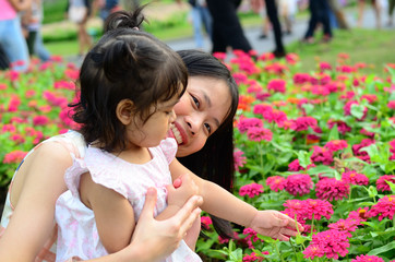 Little Child Girl and Mother at The Public Park