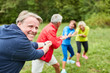© Robert Kneschke - Team beim Tauziehen als Teambuilding