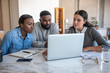© mavoimages - African American couple and their financial advisor using a laptop