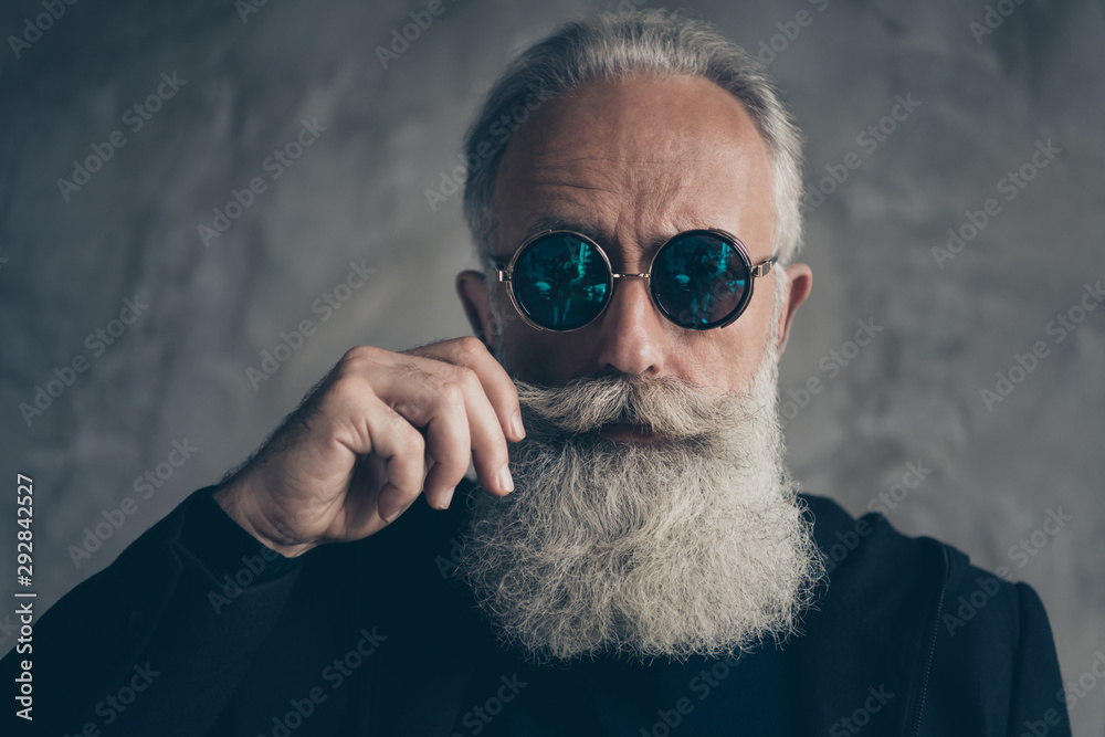 Close up photo of attractive harsh masculine pensioner in eyewear eyeglasses touching his moustache isolated over grey background - obrazy, fototapety, plakaty 