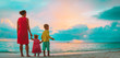 © nadezhda1906 - mother with little son and daughter looking at sunset beach