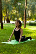 © Andrii Zastrozhnov - Beautiful young girl in park practices yoga and relaxes. Calm and tranquility.