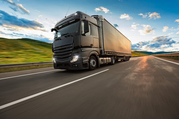 Truck with container on highway, cargo transportation concept. Shaving effect.