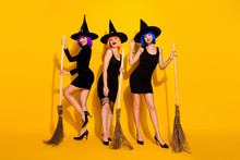 Full Length Body Size Photo Of Beautiful Attractive Pretty Cunning Gorgeous Carefree Witches Holding Using Brooms For Flying In The Night Sky Isolated Bright Shine Color Background