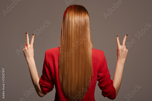 Fotomural Rear view of beautiful woman with red long hair.