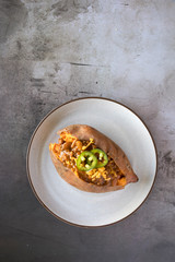 Wall Mural - Baked Sweet Potato With Chili and Cheese