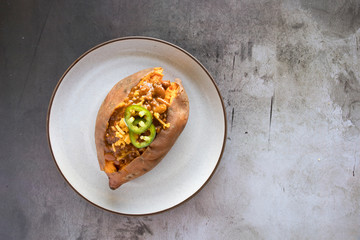 Wall Mural - Baked Sweet Potato With Chili and Cheese