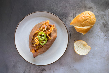 Wall Mural - Baked Sweet Potato With Chili and Cheese