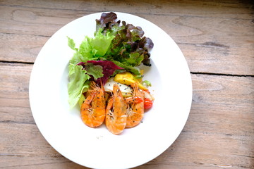 Sticker - mango salad with shrimp on wood table