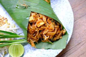 Sticker - pad thai noodle with shrimp on wood table