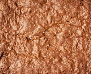 Wall Mural - fragment of baked brownie chocolate cake with cracked surface