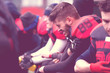 © .shock - american football player holding the injured shoulder