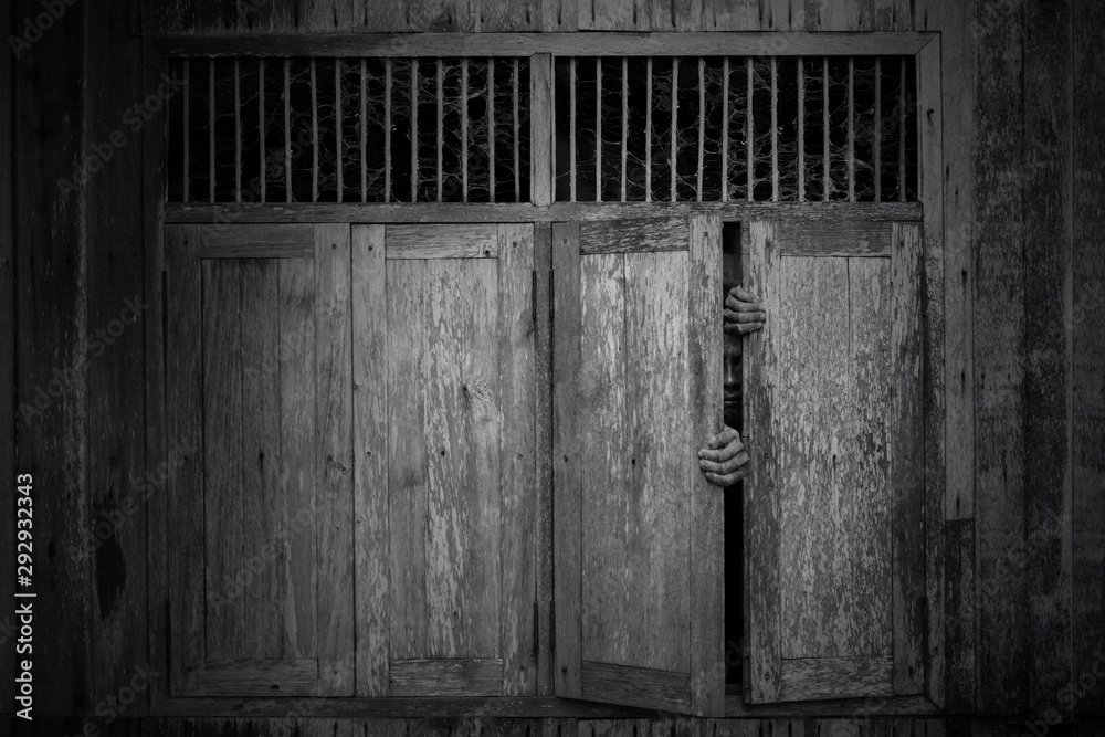 Windows Scared Anxious and scared man opened old wooden windows ajar and peeping ...