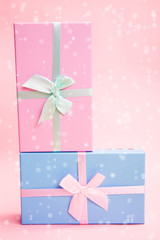 Poster - multi-colored boxes with bows on a pink background