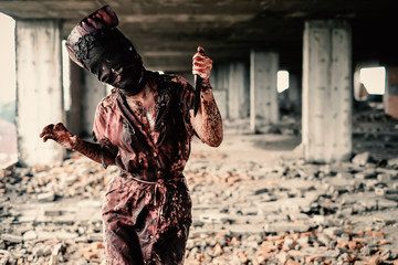 Ghost nurse woman or zombie holding the knife with resentment and malice in the building abandoned hospital.