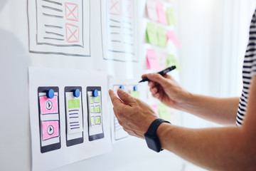 Wall Mural - close up of web developer planning application for mobile phone