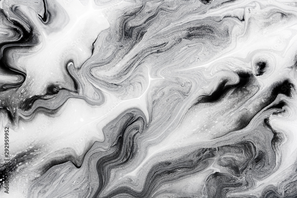 marble texture formed by mixing the black and white acrylic paint ...