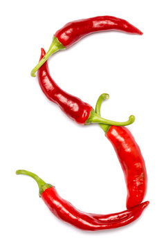 English alphabet made of chili peppers on white background. Font made of hot red chili pepper isolated - letter S.