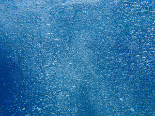 Wall Mural - Abstract background of underwater bubbles in the Aponissos beach, Agistri island, Saronic Gulf, Attica, Greece.