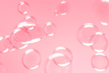 Beautiful Bright Soap Bubbles On Pink Background