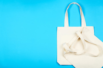 Poster - White cotton eco bags on blue background