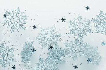 Wall Mural - festive winter background with decorative snowflakes in flying. christmas, winter or new year concep