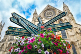 Fototapeta  - The York Minster and a sign with directions to landmarks in the city
