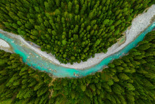 Inn River Flowing In The Forest In Switzerland. Aerial View From Drone On A Blue River In The Mountains