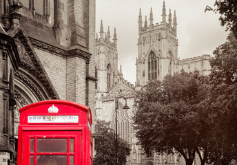 Poster - Old british red phone booth with the York Cathedral -  Background toned in sepia