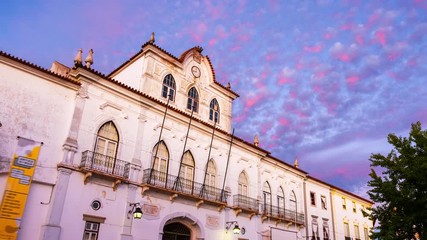 Sticker - Evora, Portugal. View of the Town Hall in Evora, Portugal during the sunset. Beautiful landmark with colorful sky in summer. Time-lapse in the evening, zoom in