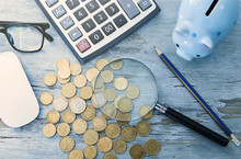 Piggy Bank; Coins; Calculator On A Blue Background. Business Concept
