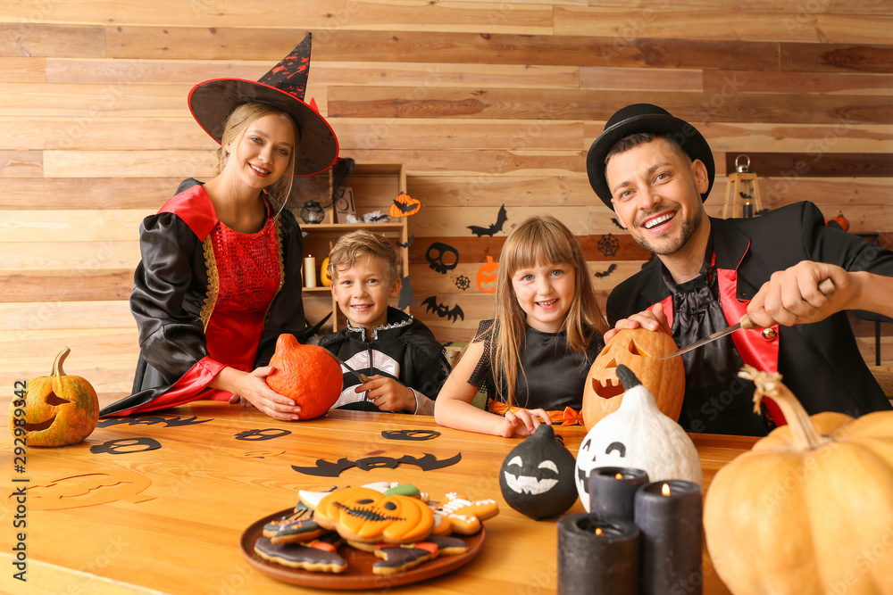 Family preparing for Halloween celebration at home