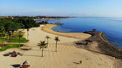 Wall Mural - Beautiful view of white sand beach at luxury resorts of Bali.