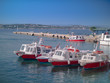 Multiple boat taxis at a pier in Greece